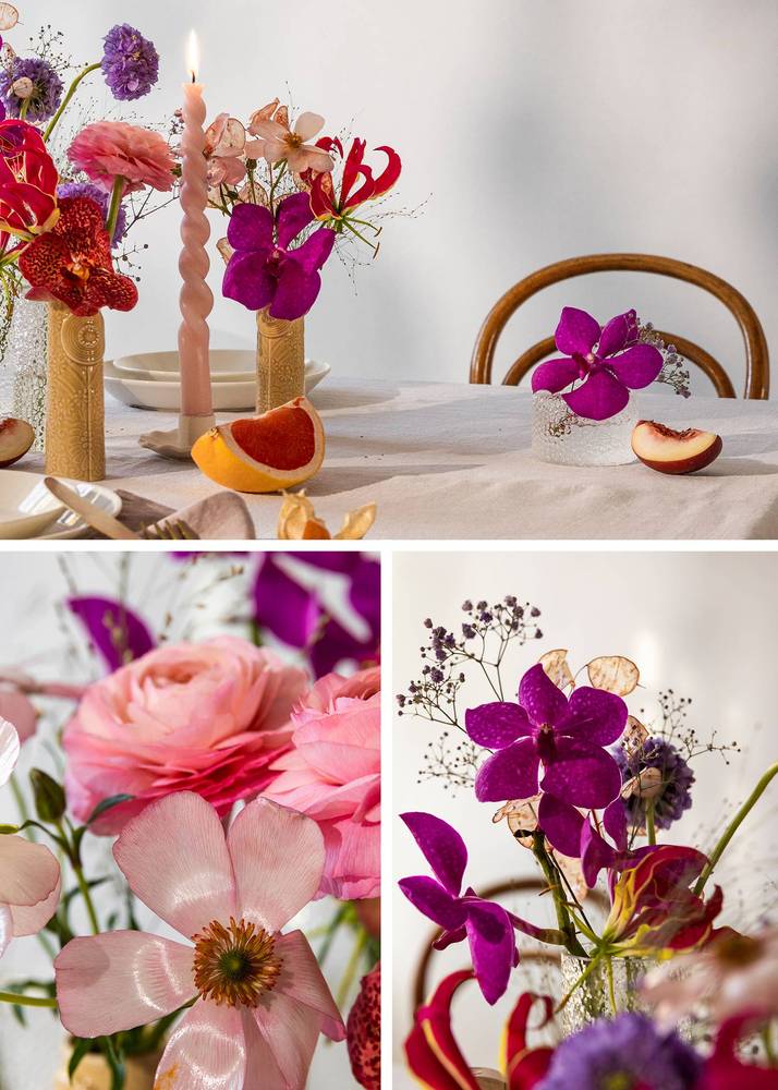 Des fleurs multicolores dans les tons lilas et rose sur la table de mariage décorée